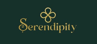Gold Serendipity text with decorative clover symbol on dark teal background